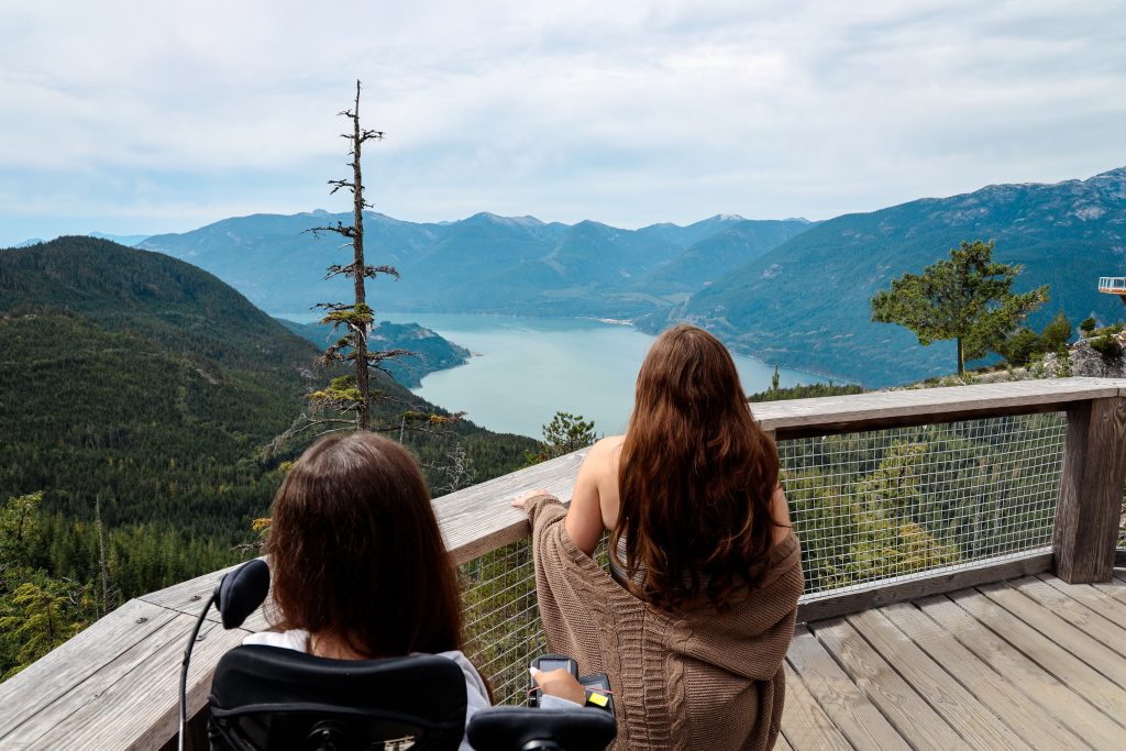 Tori and her friend looking out at the view on the viewing platform at the sea to sky gondola
