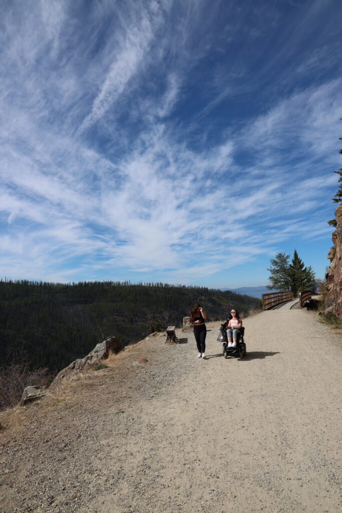 Tori and her friend walking along the trail at the Myra canyon trestles