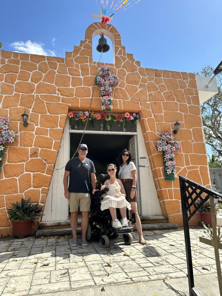 Tori and her family in front of a Catholic church built in the 1840s