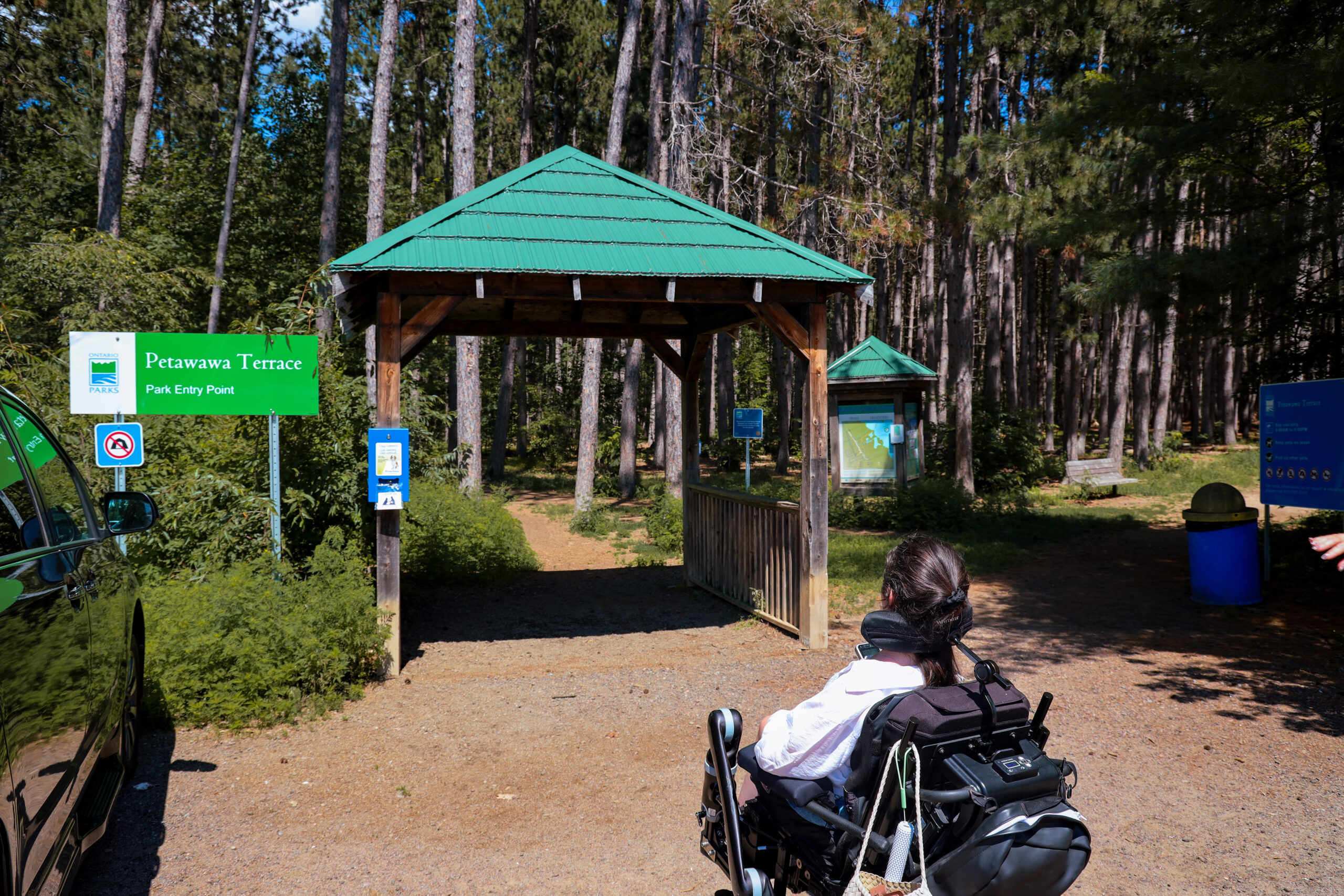 The accessible entry point to Petawawa Terrace Provincial Park in Ontario, showing the wooden trailhead shelter and "Petawawa Terrace Park Entry Point" sign at the start of the Aki Trail.