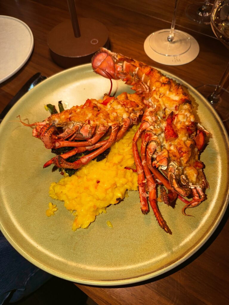 Baked lobster served over saffron risotto at Drift, a wheelchair accessible restaurant inside the Muir hotel on the Halifax waterfront in Nova Scotia